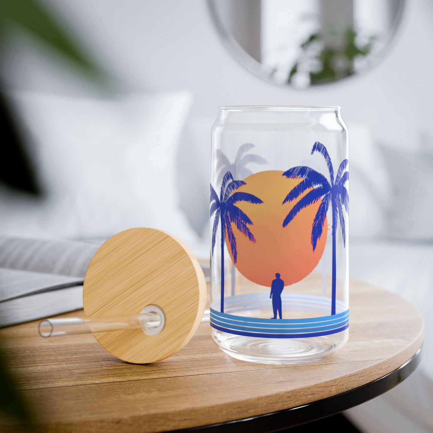 palm tree glass tumbler with bamboo lid on wooden table