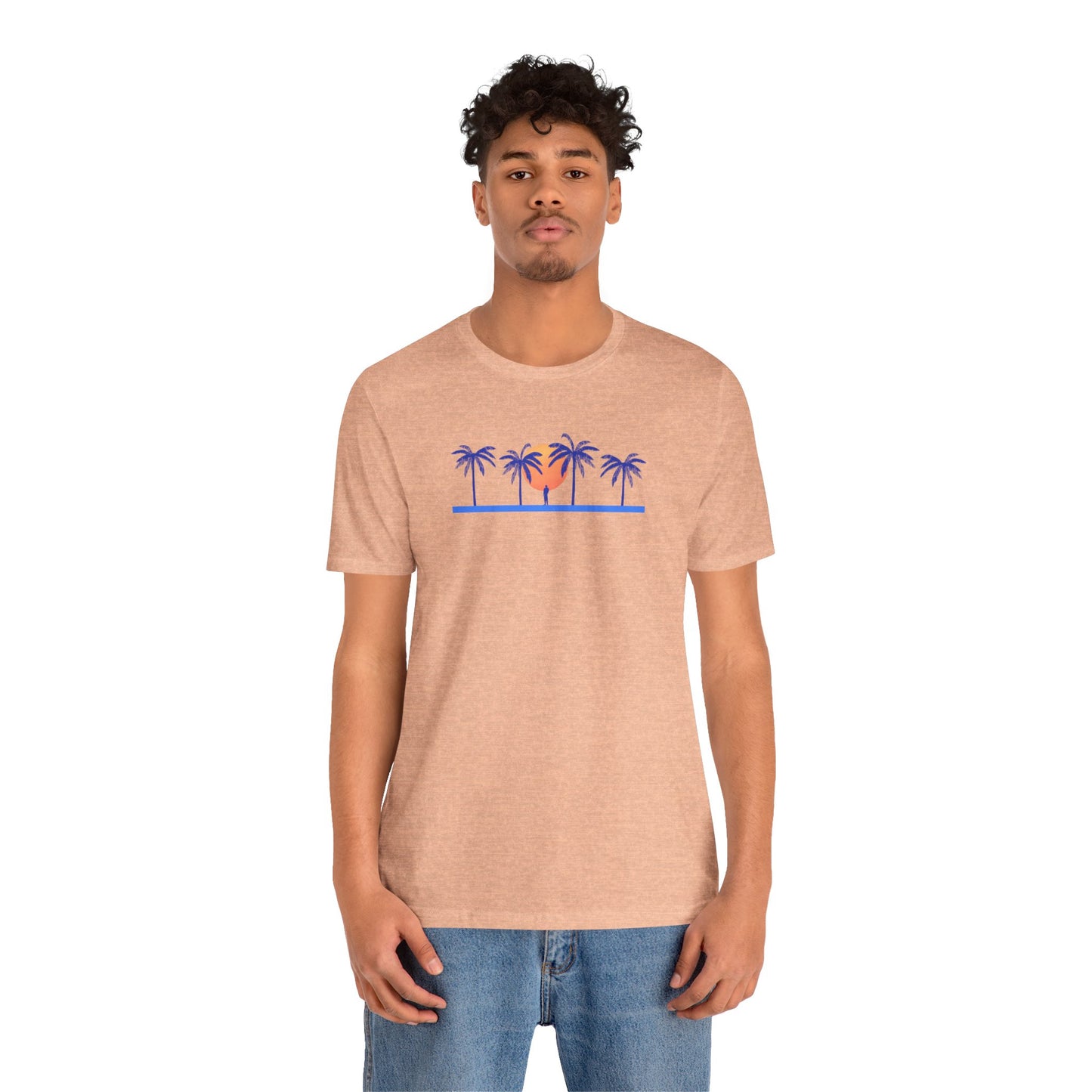 Retro unisex tropical orange t-shirt with blue palm trees and sunset illustration, worn by a man